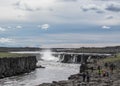 Powerful Dettifoss waterfall with black basalt columns and water spray in sunny day, North Iceland, Europe